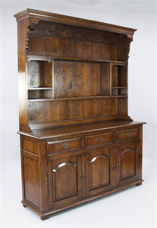 A modern oak panelled back dresser, W. 5ft. D. 1ft 6in. H. 6ft 6in.